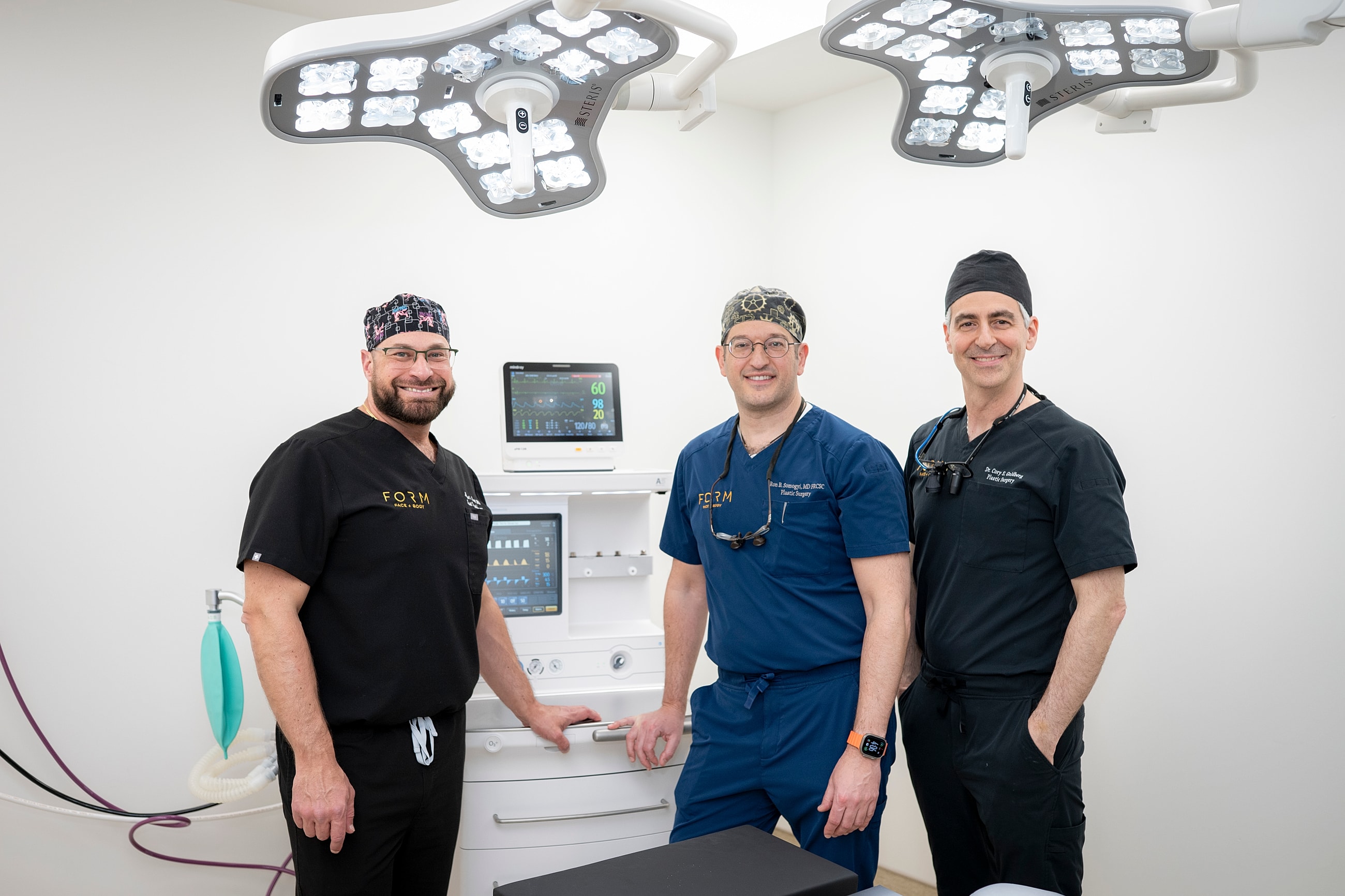 Three doctors in a modern medical office.