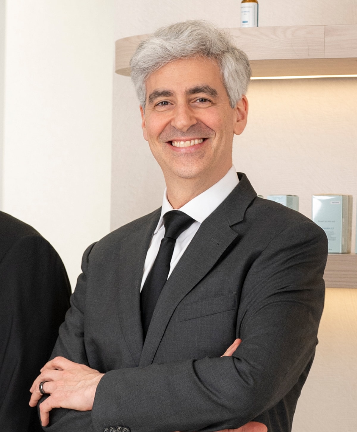 Man with gray hair in casual attire.