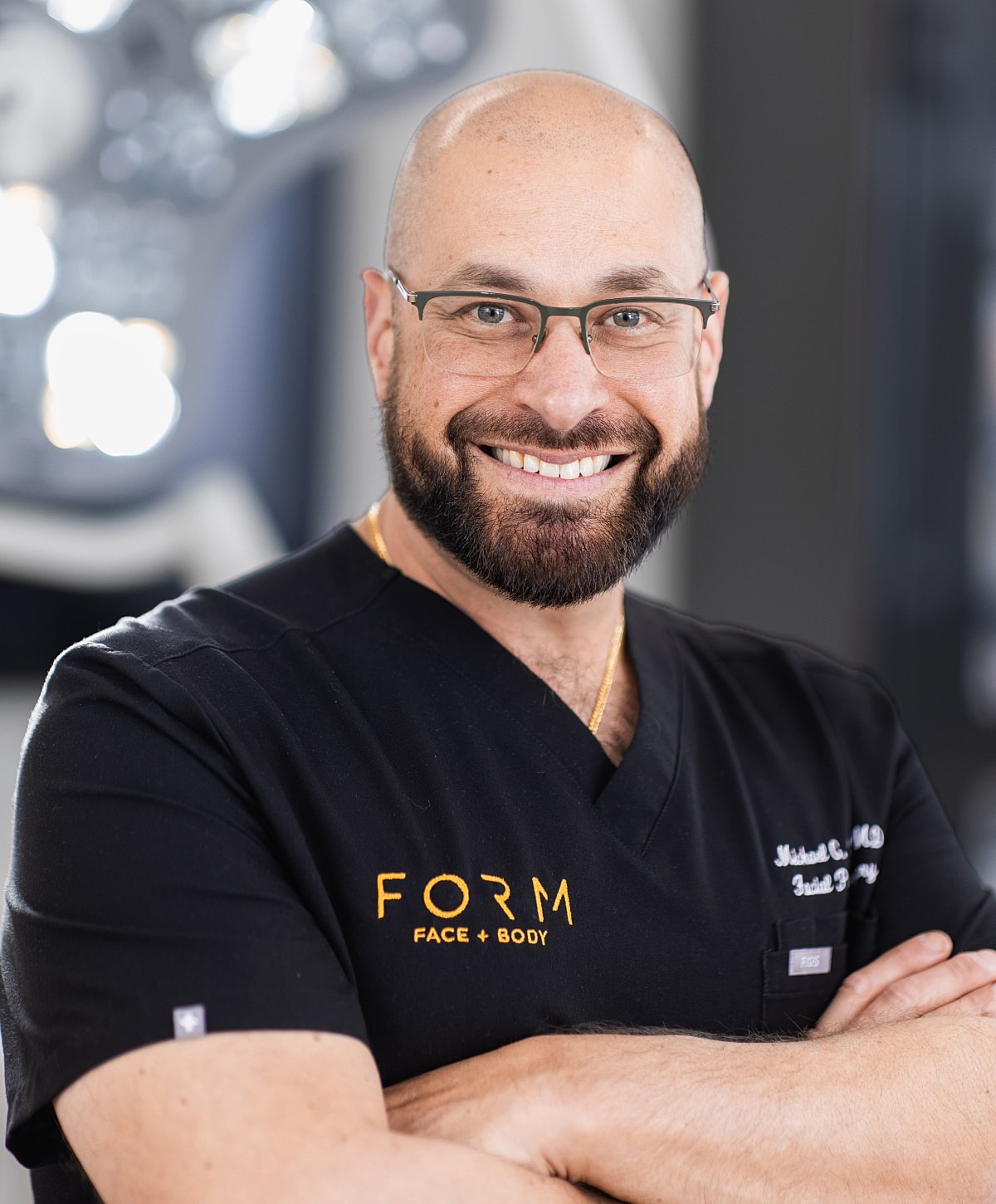 Smiling medical professional in scrubs portrait.