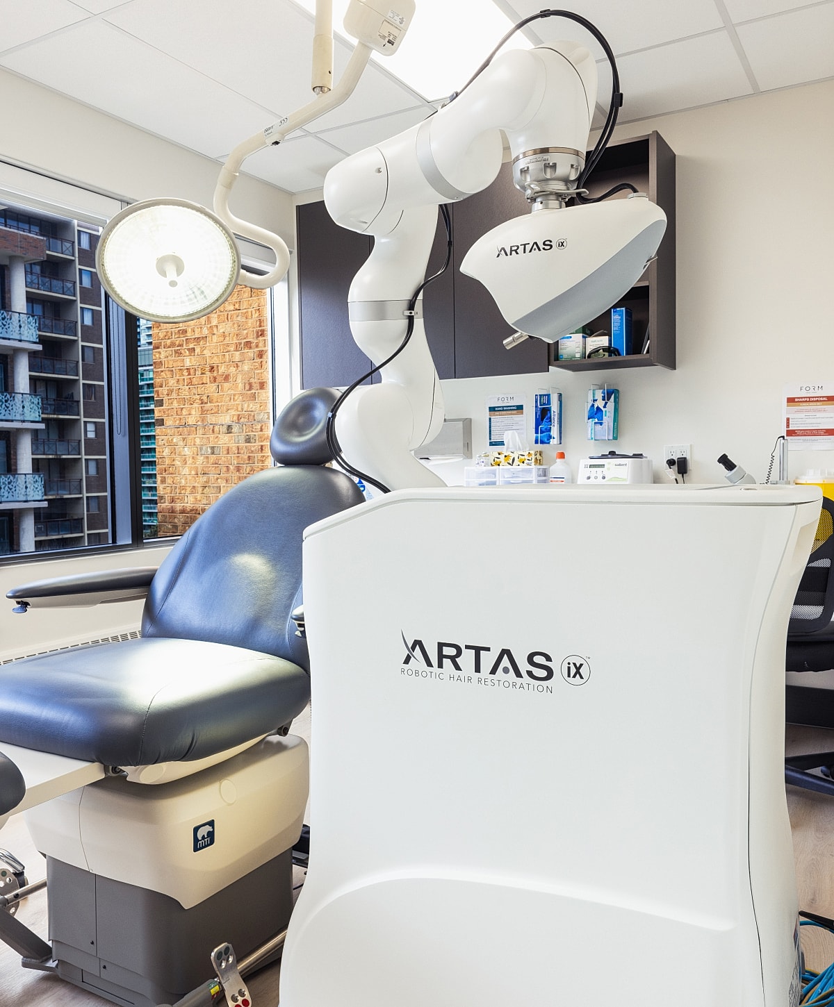Robotic hair restoration equipment in clinic setting.