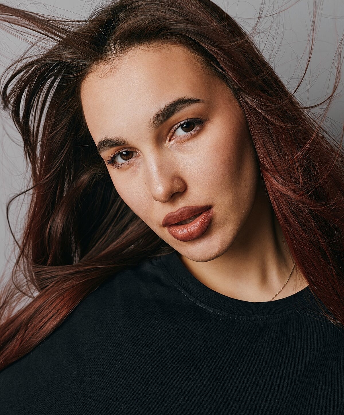 Portrait of a woman with flowing hair.