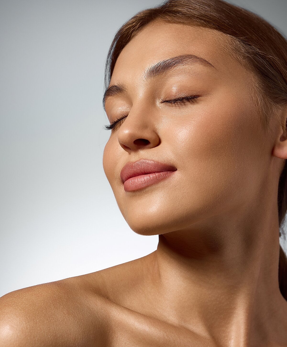 Close-up of a woman with flawless skin.