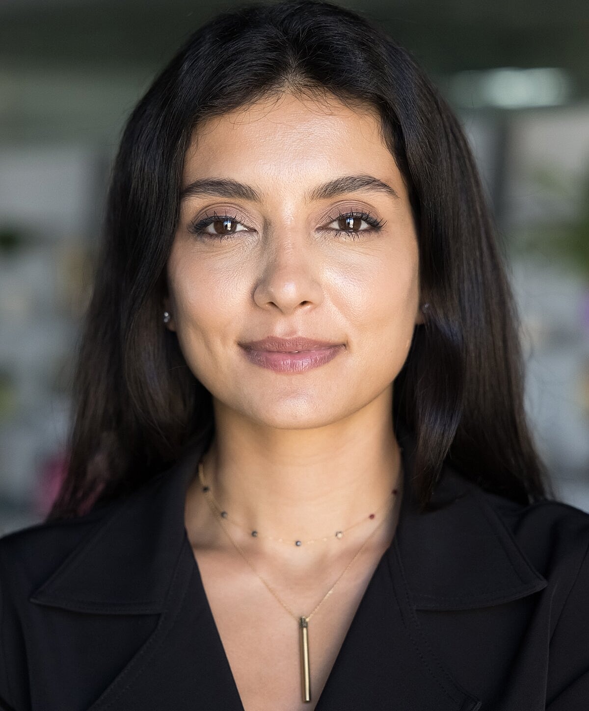 Confident woman smiling in professional attire