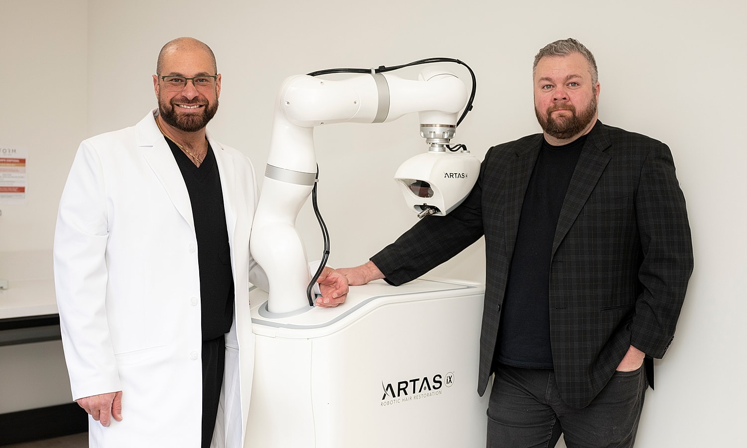Doctors with robotic hair restoration technology.