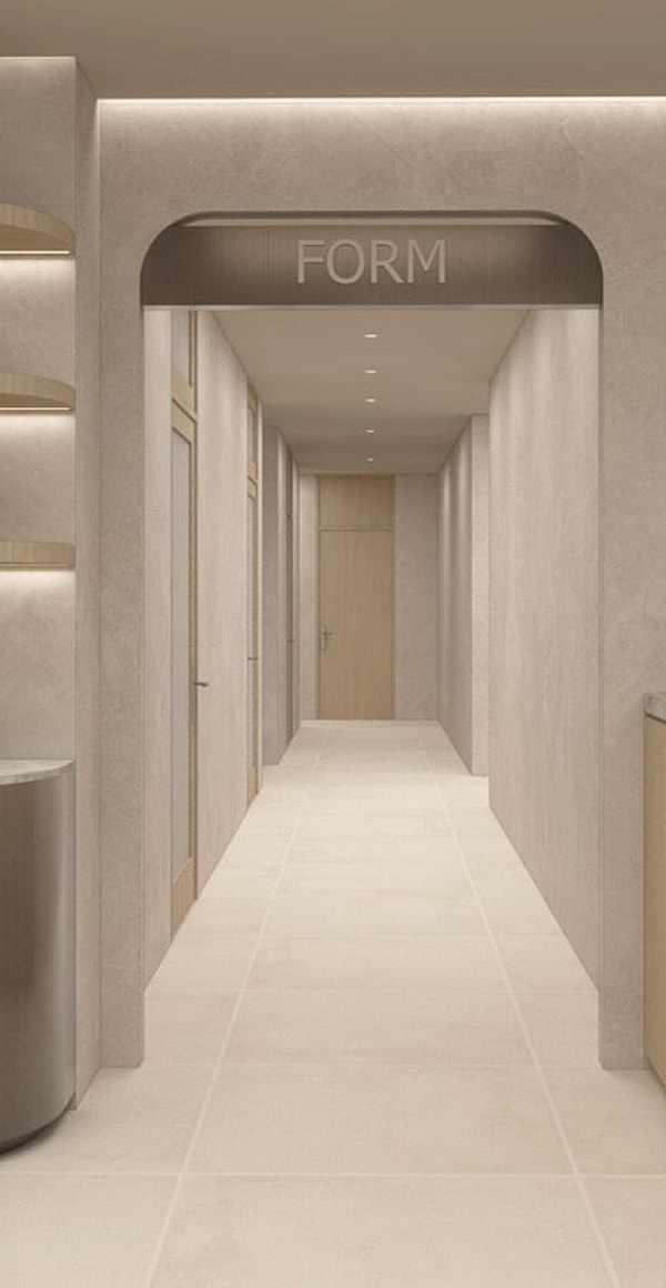 Modern hallway with FORM sign above entrance.