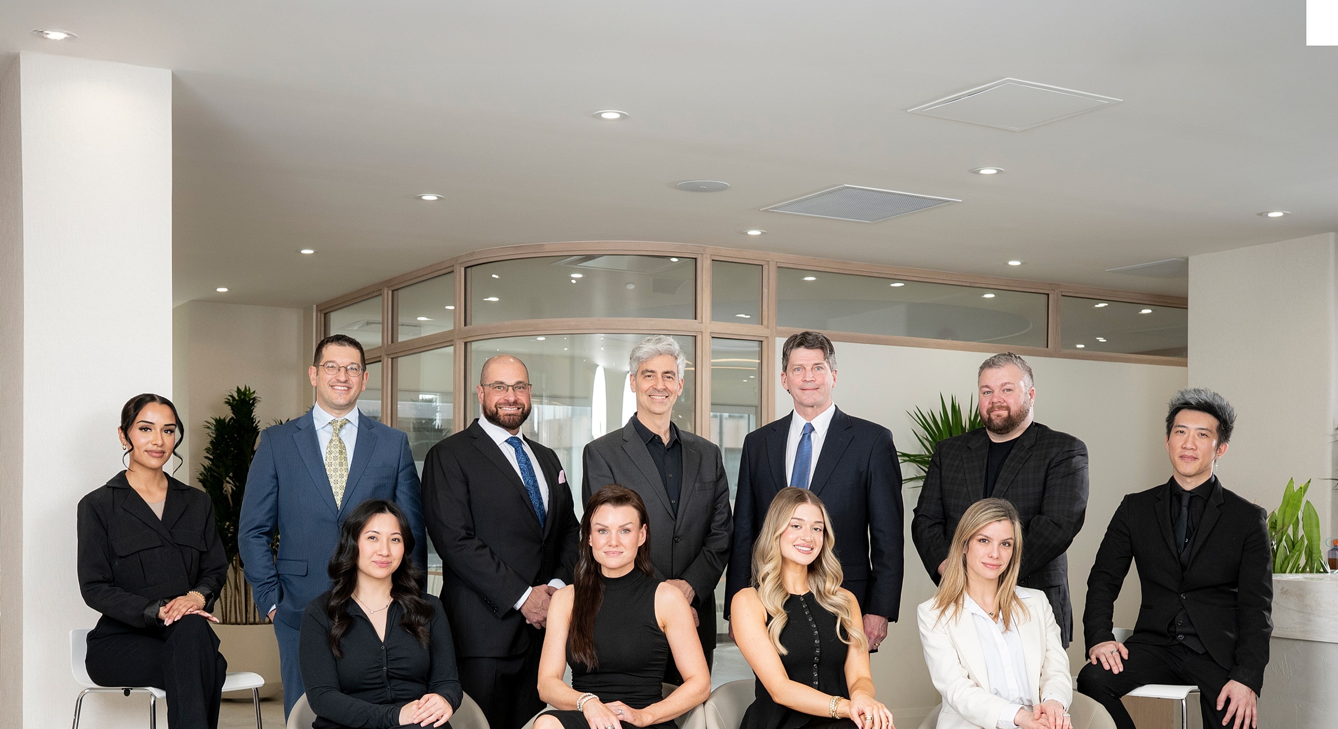 Group photo of six smiling professionals.