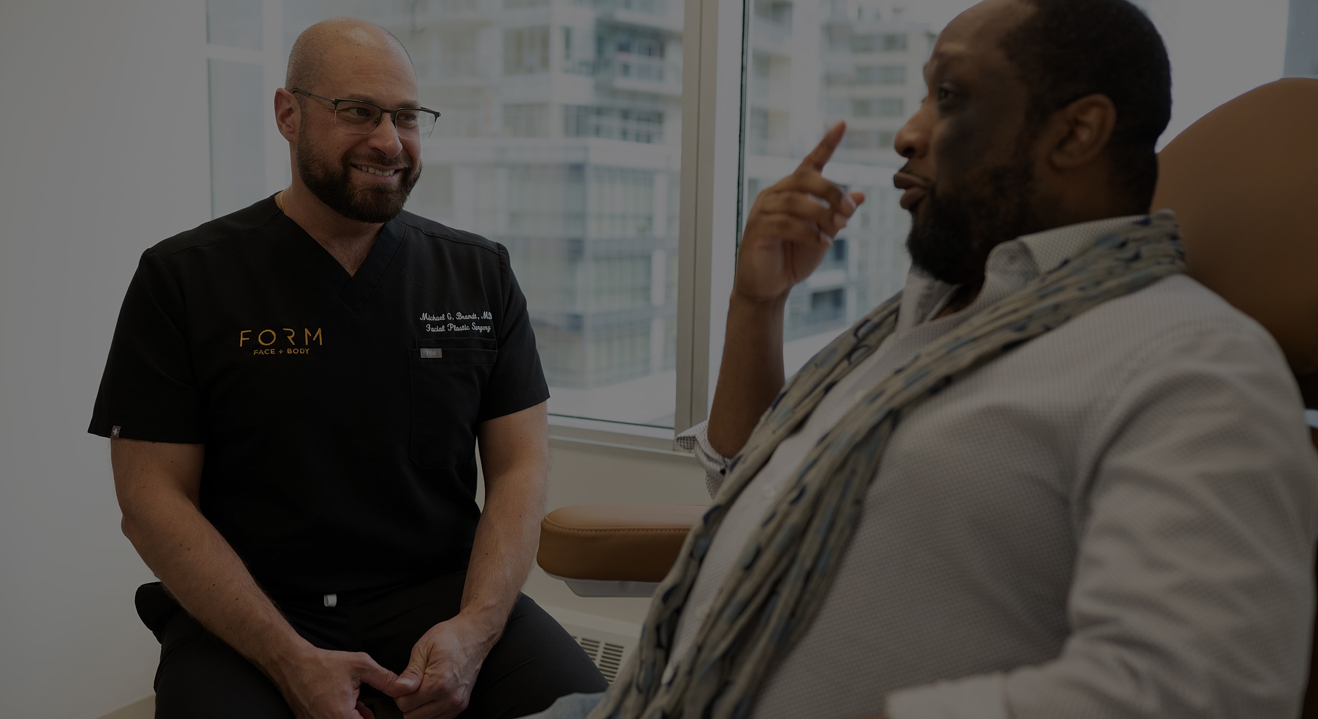 Doctor consulting with patient in office setting.
