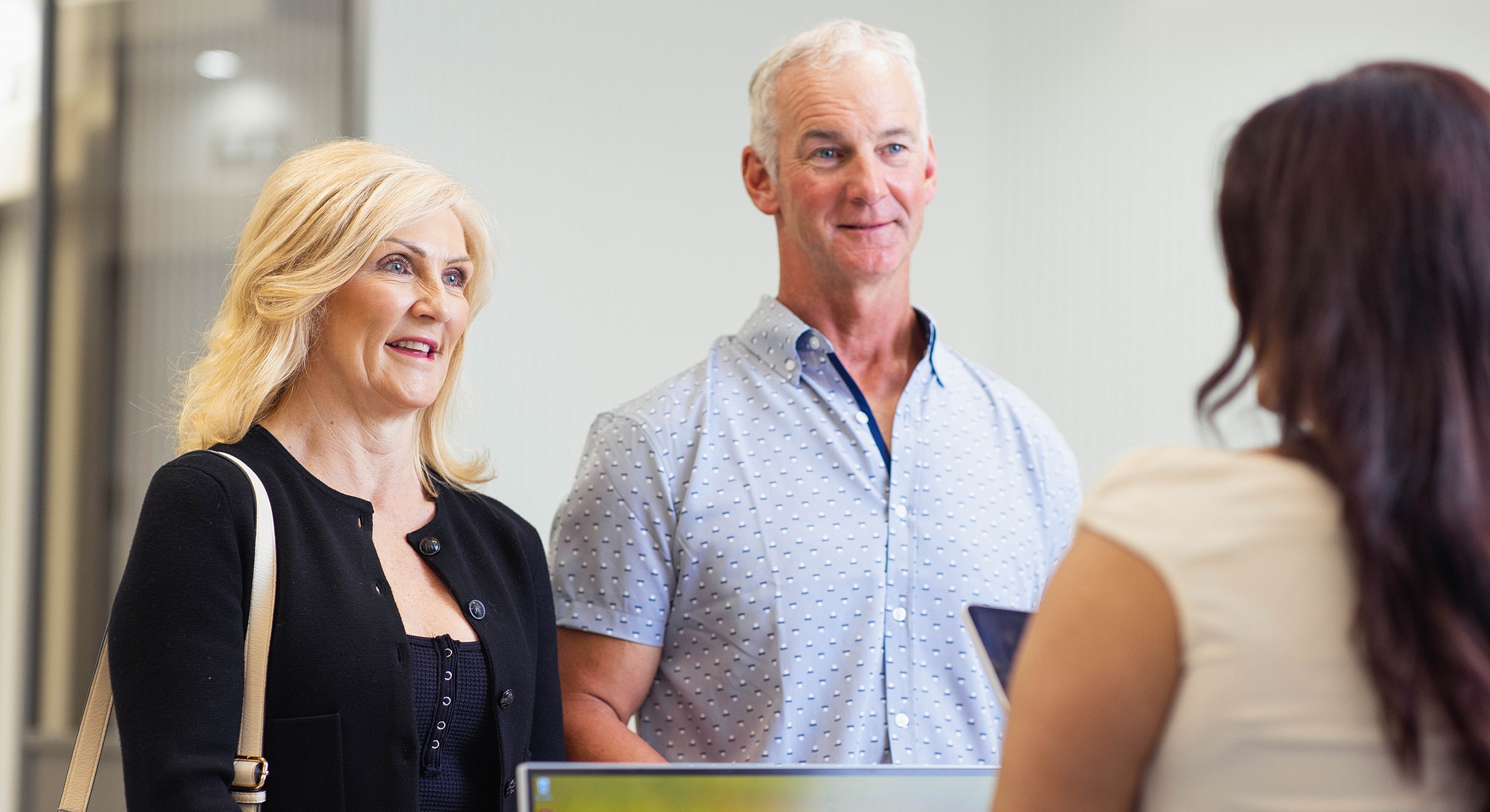 Couple interacting with a service representative.